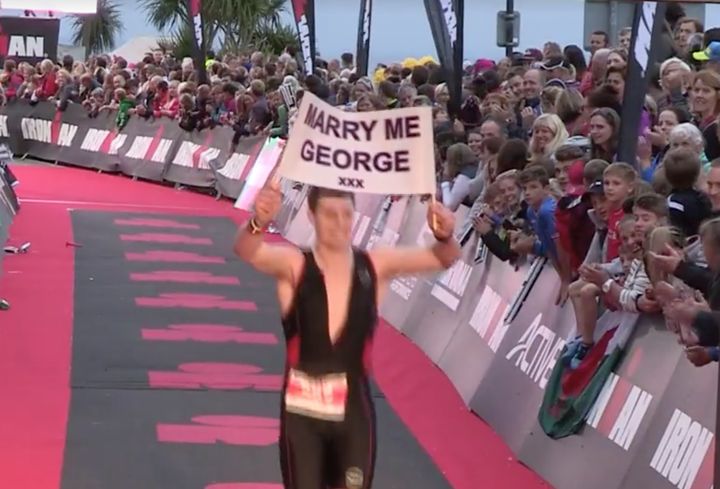 Sam crossing the line with his sign