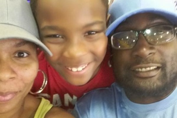 An undated photo of Keith Lamont Scott (right) and family members from a GoFundMe account established in his name. 