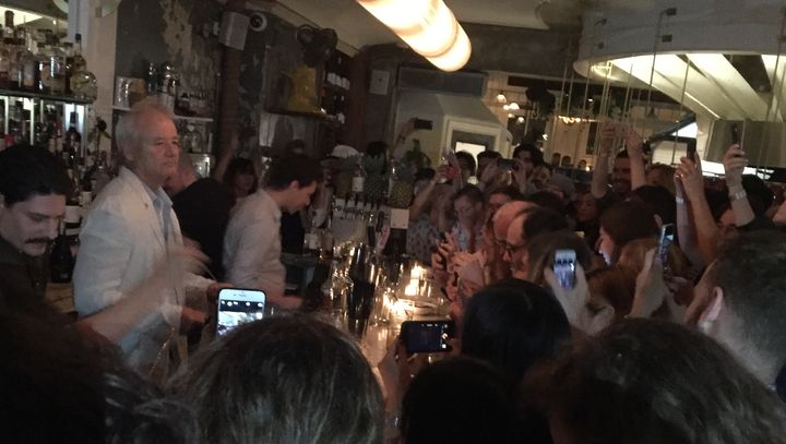 Bill Murray tends bar at 21 Greenpoint in Brooklyn, New York. 