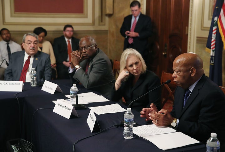 Sen. Kirsten Gillibrand (D-N.Y.), listens to Rep. John Lewis (D-Ga.), speak during a discussion on the state of voting rights