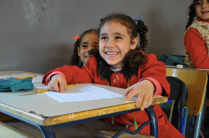 Refugee Syrian Children attending a double-shift school in Lebanon