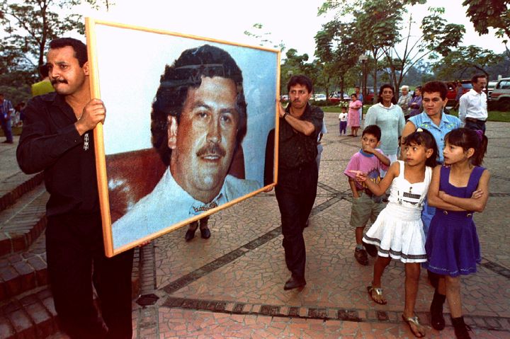 Men carry a picture of Pablo Escobar through the streets of Medellin Dec. 2, 1994 on the first anniversary of his death.