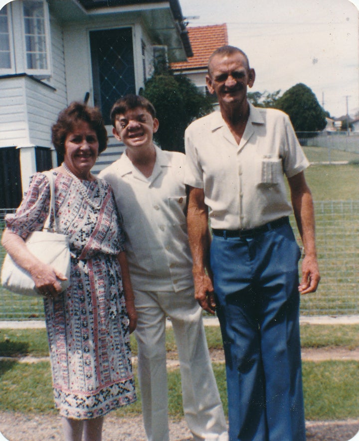 Robert with his parents.