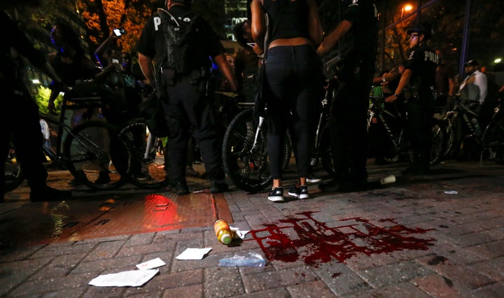 Blood covers the pavement where a person was shot in uptown Charlotte, NC during a protest of the police shooting of Keith Scott, in Charlotte, North Carolina on September 21, 2016.