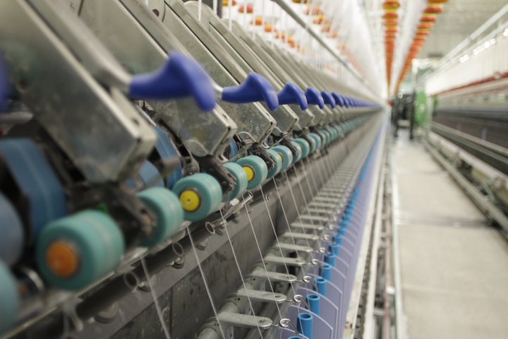 Fibers being spun into yarn.