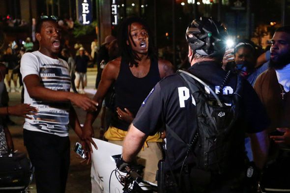 Protesters are confronted by police in Charlotte, NC.