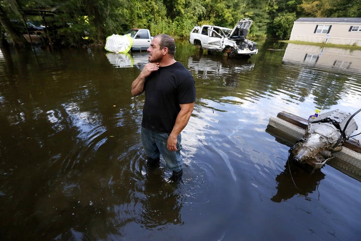 Jason LeBlanc pauses to survey his flooded neighborhood in Sorrento, Louisiana, on Aug. 20, 2016.