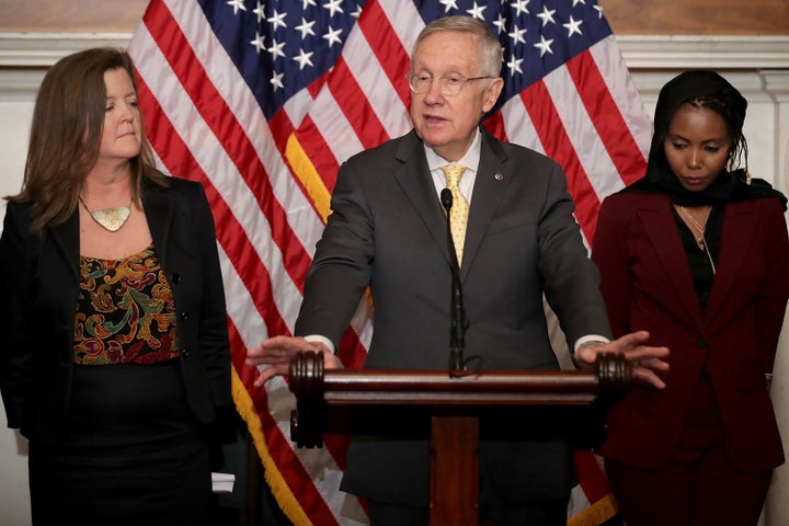 SEPTEMBER 22: Senate Minority Leader Harry Reid (R-NV) (C) holds a news conference with Equality Now Director Shelby Quast (L