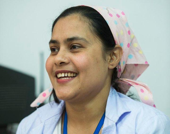 Fatema Begum provides family planning information as a peer educator at a garment factor in Dhaka, Bangladesh. “I feel good about providing services that help the workers,” she says.