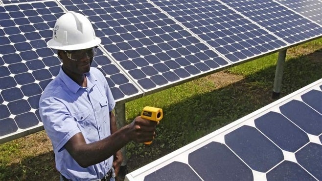 A solar energy ballot issue in the Sunshine State is attracting millions in contributions, reflecting a trend in many states. Above, an engineer checks panels at a solar farm in Florida.