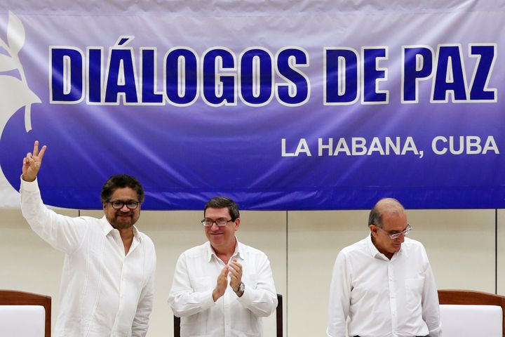 Colombia's FARC has ratified a peace accord to end the five-decade war. Pictured here, Colombia's FARC lead negotiator (L), Cuba's Foreign Minister (C) and Colombia's lead government negotiator smile after signing a final peace deal on Aug. 24, 2016.
