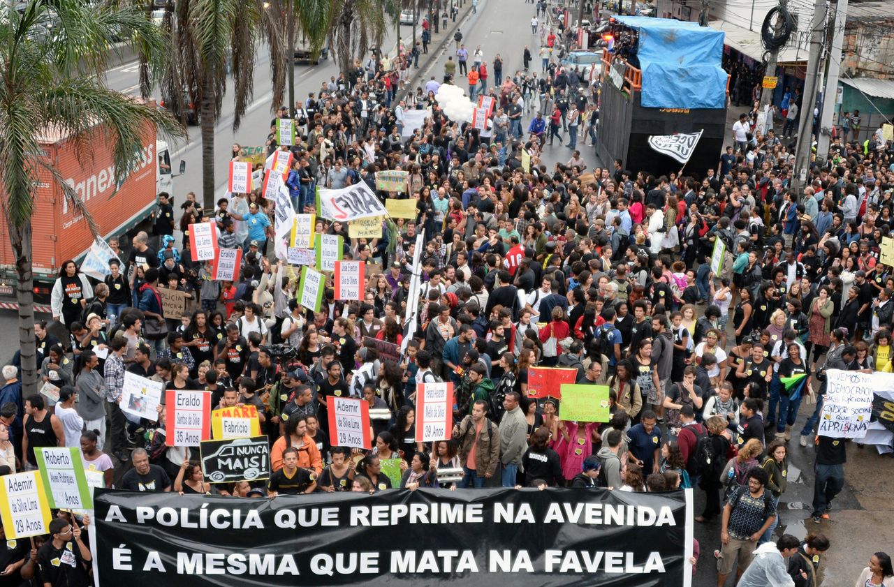 Residents of the Maré favela block a major avenue to demonstrate against police violence in July 2013.