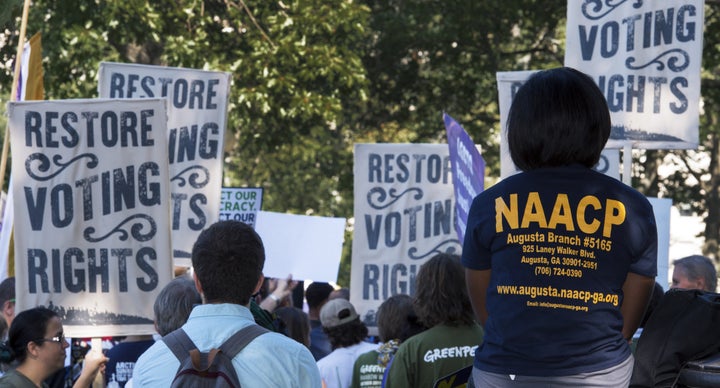 Various labor unions and progressive organizations protest on Capitol Hill, calling for the restoration of the Voting Rights Act, part of which was struck down by the U.S. Supreme Court in 2013.