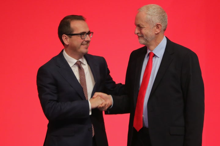 Owen Smith shakes hands with Jeremy Corbyn MP ahead of the leadership election results Saturday.