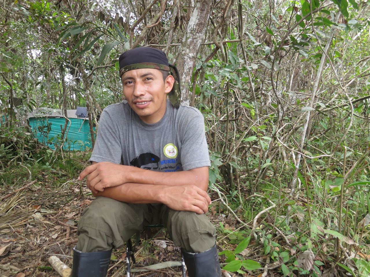 FARC fighter Roberto Méndez sits outside a guerrilla camp near where the FARC held its 10th conference, in the Yari Plains. Sept. 18.