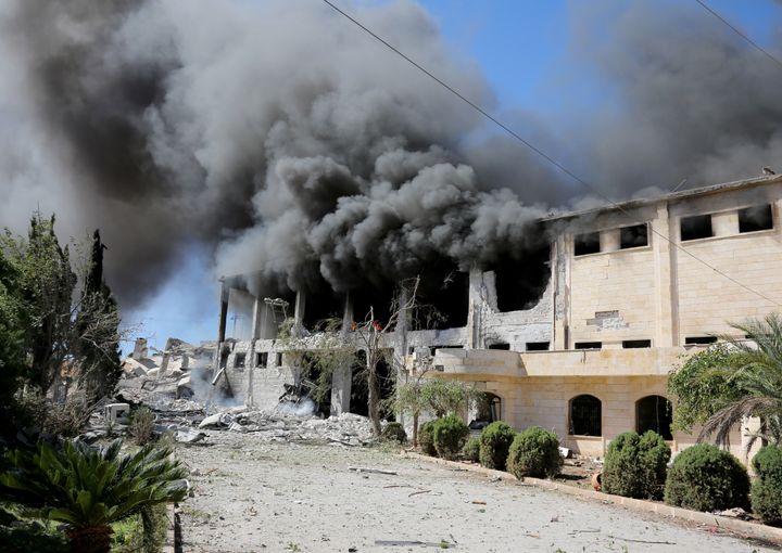 Smoke rises from a thread factory which was hit by airstrikes.