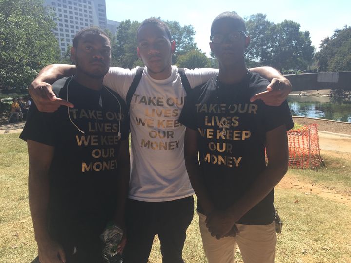 Chris Miles, Kalvon Turner and Malcolm Turner (from left to right) are encouraging black people to stop supporting major corporations. 