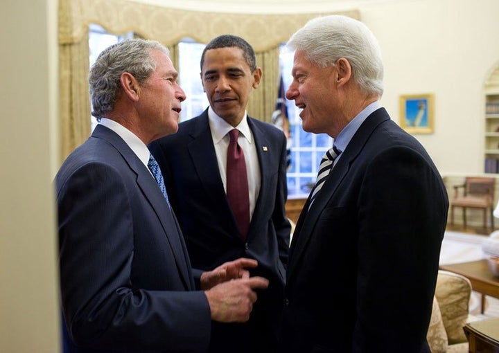 Pres. Bush chatting with Pres. Clinton as Obama watches during a visit to the White House.