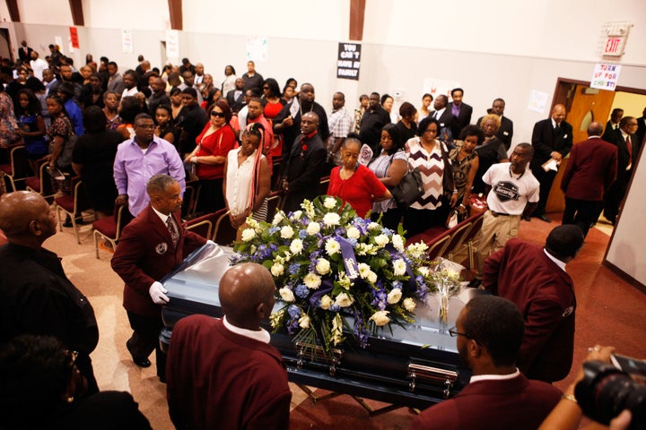 Terence Crutcher's casket is moved out of the church at the end of his funeral in Tulsa, Oklahoma.