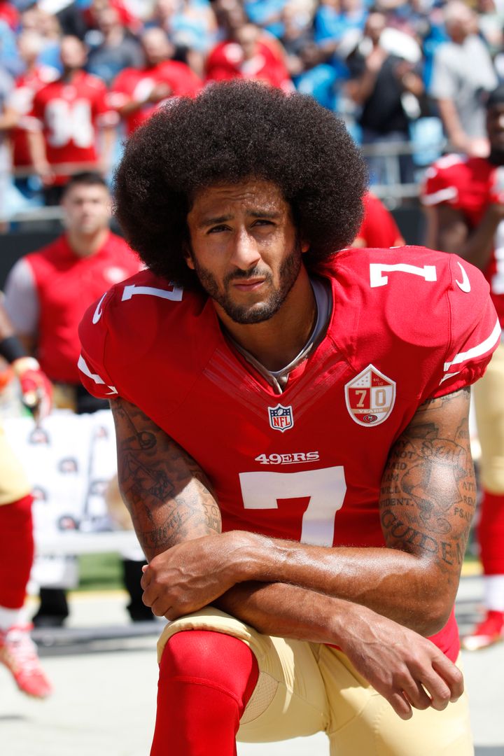 Kaepernick takes a knee during the national anthem. 