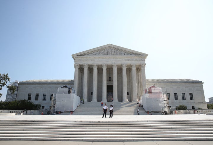 Guards stand in front of the U.S. Supreme Court, September 7, 2016 in Washington, D.C.