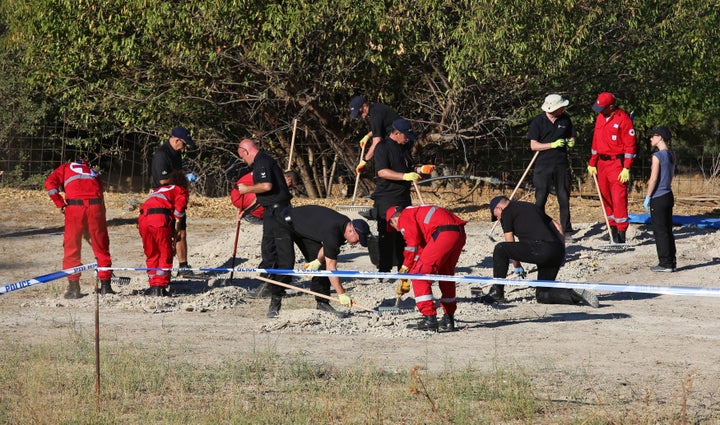 Officers from South Yorkshire Police excavating land in the hunt for the missing toddler 