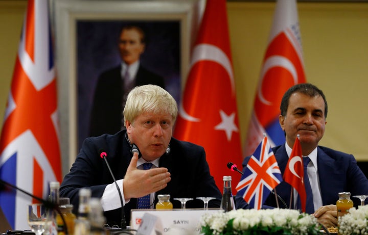 British Foreign Secretary Boris Johnson holds a joint news conference with Turkey's European Union Affairs Minister Omer Celik in Ankara, Turkey