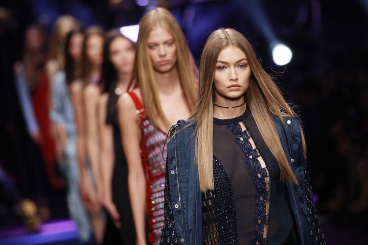 Gigi Hadid walks the runway at the Versace show during Milan Fashion Week.