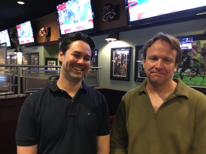 John Blair (left) and his friend Markus Rose, both Democrats, attended the debate-viewing party without realizing Genera