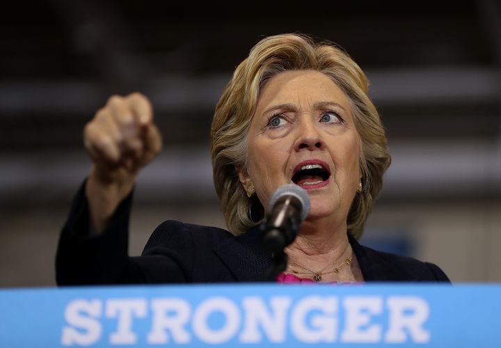 GOP presidential nominee Donald Trump "really started his political activity based on this racist lie that our first black president was not an American citizen," Hillary Clinton said on Monday.