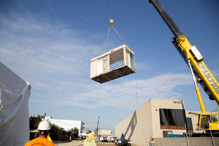 The first shipping containers arrive for the construction of Potter's Lane.