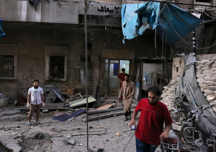 Medics inspect the damage outside a field hospital after an airstrike in the rebel-held al-Maadi neighbourhood of Aleppo, Syria, on Wednesday.