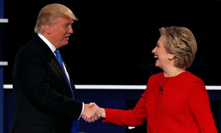 Republican U.S. presidential nominee Donald Trump and Democratic U.S. presidential nominee Hillary Clinton shake hands.