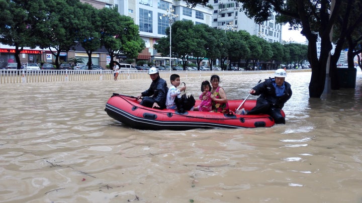 Heavy typhoon rains caused a landslide to crash into China's Sucun village on Wednesday.