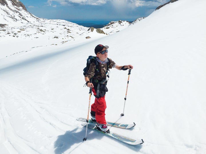 The author’s son, Luke, ascends a slope while backcountry skiing with his father near Nederland, Colorado.