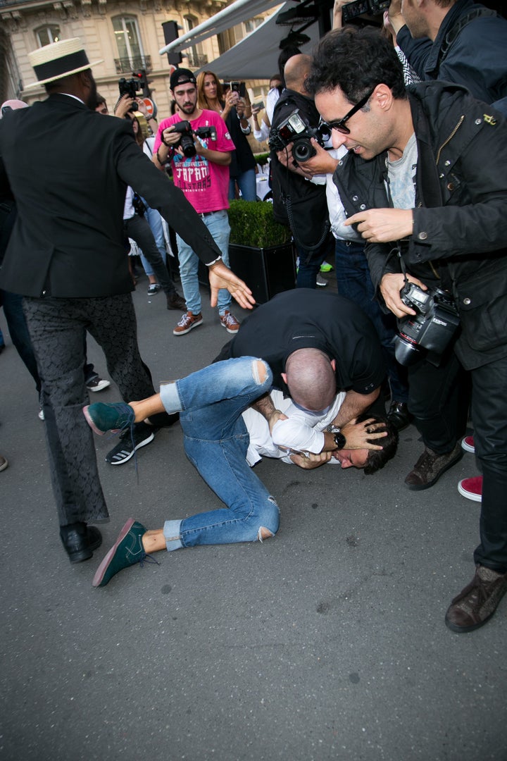 Bodyguard Pascal Duvier immobilizes Vitalii Sediuk after jumping on Kim Kardashian West in Paris. 