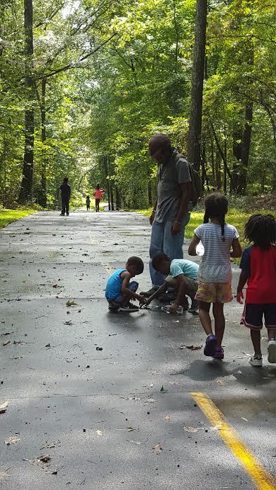 Walli Williams with students on a trail