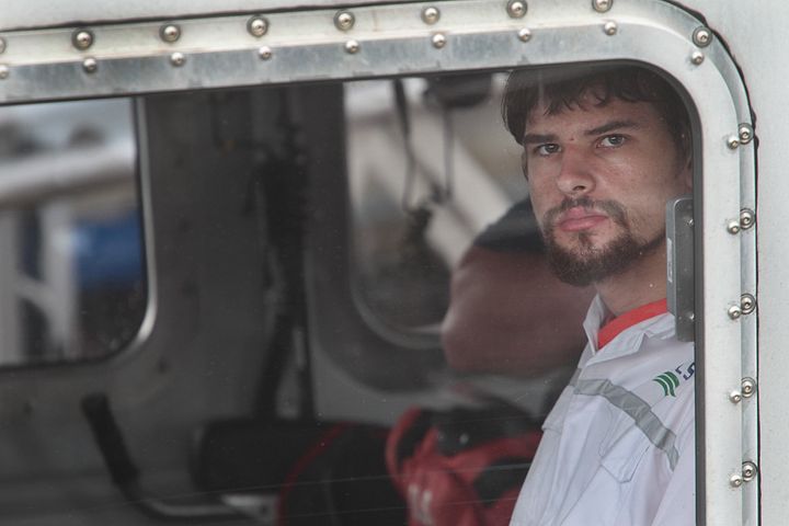 Nathan Carman, 22, is seen arriving in Boston on Tuesday after being rescued from a lifeboat off Martha's Vineyard on Sunday.
