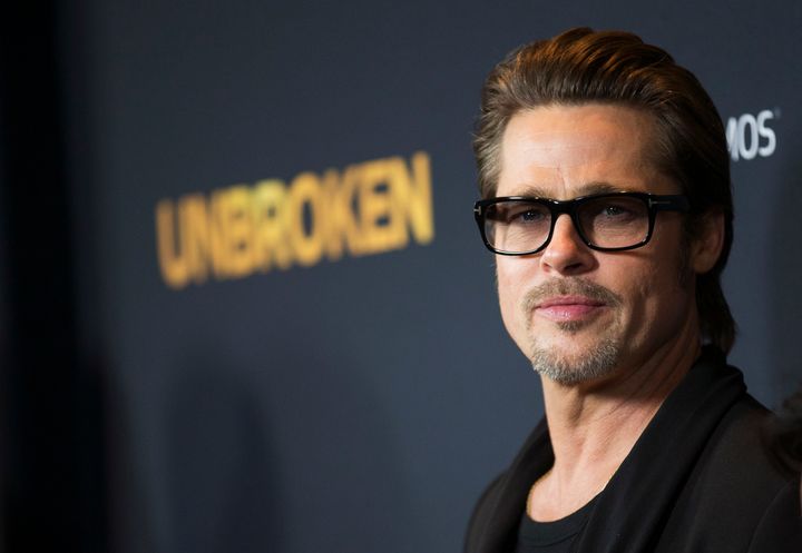 Actor Brad Pitt poses at the premiere of "Unbroken" at Dolby theatre in Hollywood, California Dec. 15, 2014.