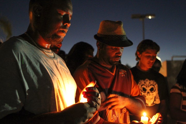 Mourners and activists hold a candle light vigil during a rally in El Cajon, a suburb of San Diego.