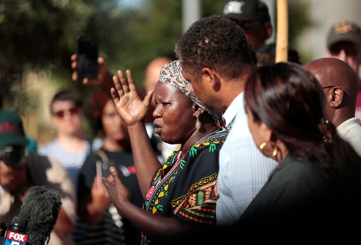 Agnes Hasam, a family friend of the Alfred Olango, speaks to protesters gathered at the El Cajon Police Department headquarters to protest fatal shooting of an unarmed black man Tuesday by officers in El Cajon.