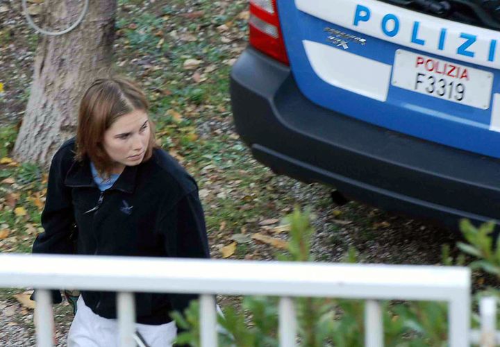 Knox stands outside her Perugia home just days after Kercher's murder. 