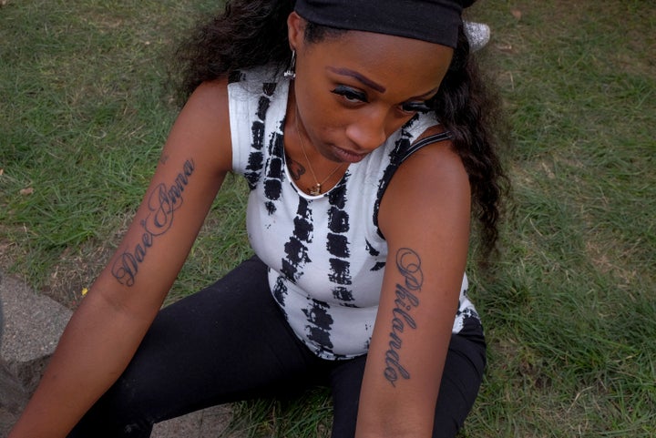 Diamond Reynolds shows off the tattoos she received the day before - one honoring her daughter, left, the other honoring her slain boyfriend.