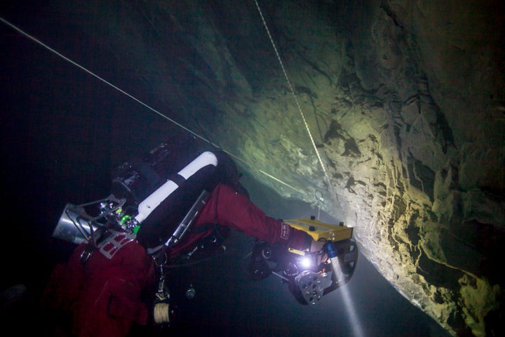 The remotely operated vehicle descending toward the bottom of the cave.