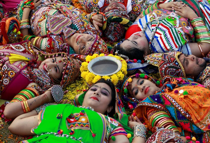 Participants dressed in traditional attire pose during rehearsals for Garba, a folk dance, ahead of Navratri, a festival during which devotees worship the Hindu goddess Durga and youths dance in traditional costumes, in Ahmedabad, India Sept. 27.