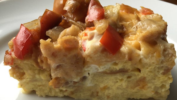 Soft cubes of baguette, fluffy eggs, juicy sausage and melting cheese come together in this supereasy riff on a sausage, egg