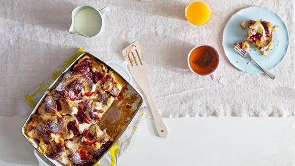 A hot, bubbling breakfast strata practically oozes comfort. This one combines tart raspberries and tangy goat cheese with ple