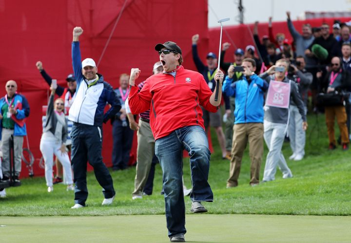 Fan David Johnson of North Dakota reacts after being pulled from the crowd and sinking a putt that pro golfers couldn't.