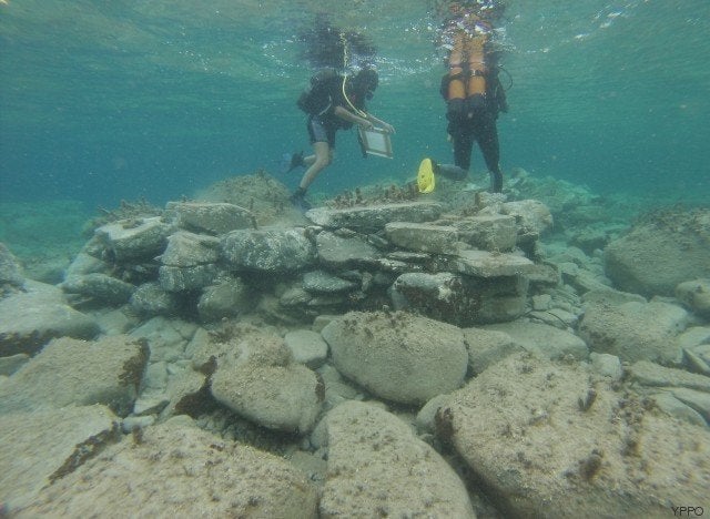 Divers inspect relics off the Greek island of Delos.