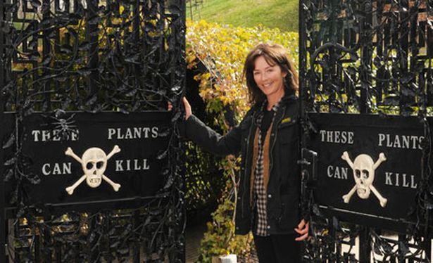 The Duchess of Northumberland at the gates of her Poison Garden at Alnwick Garden, England.